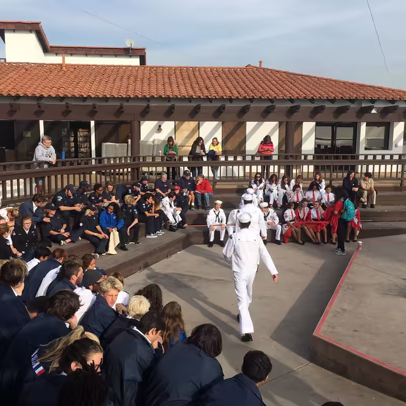 Crews in uniform at the awards ceremony in the amphitheater